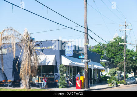 New Orleans, USA - April 23, 2018: Famous Magazine street in Garden district in Louisiana town city with La Boulangerie french bakery store shop Stock Photo