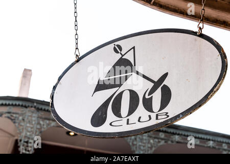 New Orleans, USA - April 23, 2018: Old town street in Louisiana famous city closeup of sign for 700 club restaurant Stock Photo