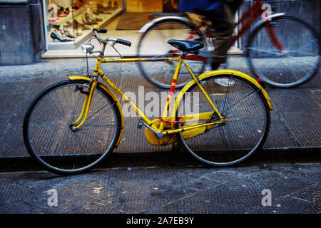 A bicycle parked on the street of an Italian city. Stock Photo