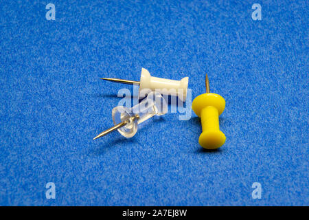 Macro push pin in the blue background Stock Photo