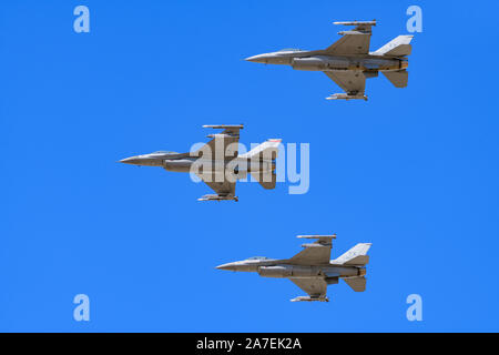 F-16V Viper Fighter Jets flying in formation with clear blue sky background Stock Photo