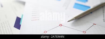 Silver pen lies on documents with Stock Photo