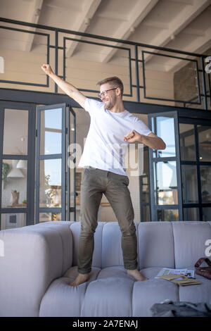 Businessman feeling positive while having rest at home Stock Photo