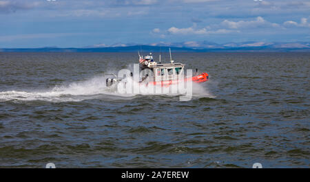 U.S. Coast Guard going maneuvering exercises in the Arctic waters of Kotzebue Sound, Alaska Stock Photo
