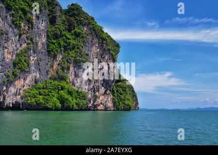 Island, Ocean views near Phuket Thailand with Blues, Turquoise and Greens oceans, mountains, boats, caves, trees resort island of phuket Thailand. Inc Stock Photo