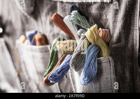 Closeup of colored threads in vintage mat tailor Stock Photo