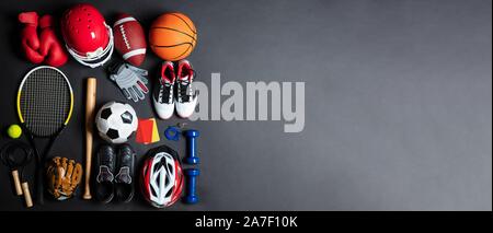 An Overhead View Of Different Sports Equipment On Gray Background Stock Photo