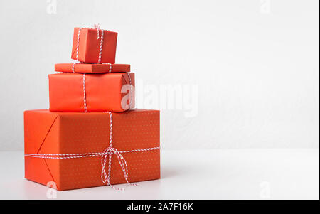 Composition of red present boxes laying out in shape of Christmas tree Stock Photo