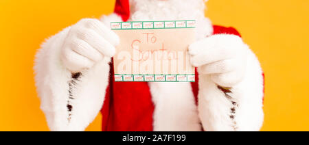 Time for writing letter to Santa with Christmas wishes on orange Stock Photo