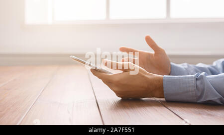 Frustrated man having problem with smartphone, closeup Stock Photo
