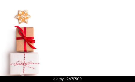 Modern Christmas tree made of gifts or presents and decorated by star Stock Photo