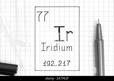 The Periodic table of elements. Handwriting chemical element Iridium Ir with black pen, test tube and pipette. Close-up. Stock Photo