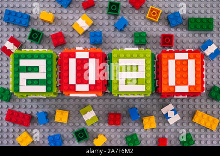 Tambov, Russian Federation - September 28, 2019 Lego New year 2020 concept with Lego cubes, bricks and gifts on gray baseplate background. Stock Photo
