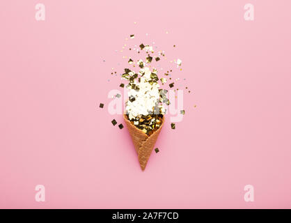 Conceptual greeting card with waffle horn and confetti inside Stock Photo