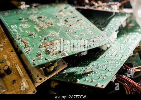 Stack of parts of demounted gadgets ready to be examined and repaired by master Stock Photo