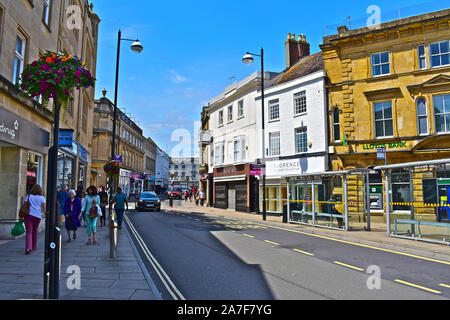 A view of High Street, in the old part of Yeovil with a mixture of banks, shops & cafés. Two jewellers shops with Art Deco style clock wall mounted ab Stock Photo