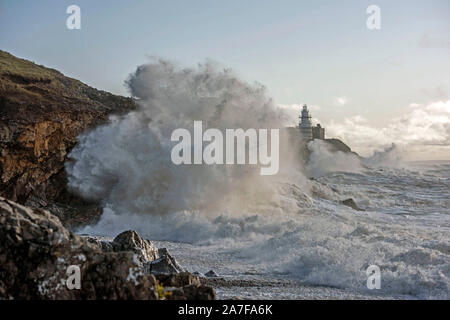 Swansea, UK. 02nd Nov, 2019. Huge waves smash into the rocks at Mumbles lighthouse near Swansea this morning. The waves were generated by the stormy weather which battered South Wales last night. Credit: Phil Rees/Alamy Live News Stock Photo