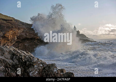 Swansea, UK. 02nd Nov, 2019. Huge waves smash into the rocks at Mumbles lighthouse near Swansea this morning. The waves were generated by the stormy weather which battered South Wales last night. Credit: Phil Rees/Alamy Live News Stock Photo