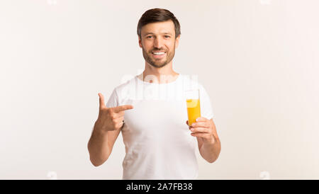 Man Holding Pointing Finger At Orange Juice Standing, Studio, Panorama Stock Photo