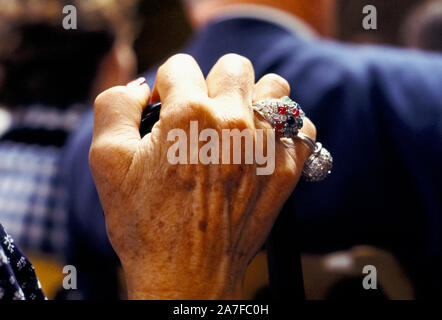 Wealthy older senior woman hand with rings at the  Sothebys auction 1970s, of the Robert Von Hirsch fine art collection sale at their Bond Street London auction house. 1978. Peter Wilson auctioneer chairman UK HOMER SYKES