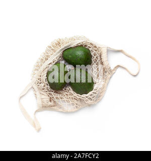 Fresh Avocado in eco bag for fruits and vegetables Stock Photo