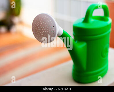 water sprinkler to hydrate plants at home Stock Photo