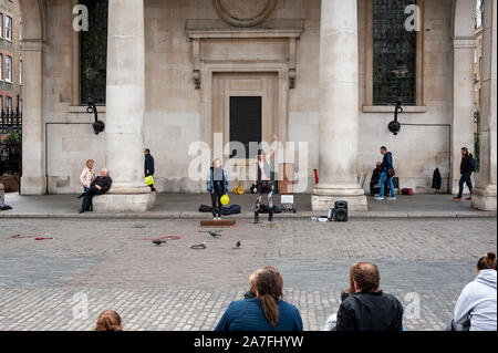 London, UK. 02-05-2019. Covent Garden Market with street performers in the square. Tourist landmark in centre of London. Stock Photo