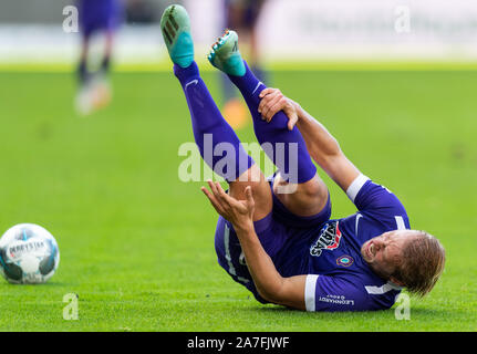 Aue, Germany. 02nd Nov, 2019. Soccer: 2nd Bundesliga, FC Erzgebirge Aue - 1st FC Heidenheim, 12th matchday, in the Sparkassen-Erzgebirgsstadion. Aues Jan Hochscheidt is lying on the ground after a foul. Credit: Robert Michael/dpa-Zentralbild/dpa - IMPORTANT NOTE: In accordance with the requirements of the DFL Deutsche Fußball Liga or the DFB Deutscher Fußball-Bund, it is prohibited to use or have used photographs taken in the stadium and/or the match in the form of sequence images and/or video-like photo sequences./dpa/Alamy Live News