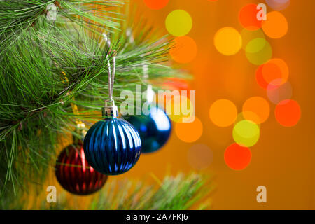 Christmas and New Year holidays background. Christmas balls hanging on  fir tree Stock Photo