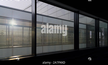 Business background - windows in typical corporate or public building interior with sunlight. Stock Photo