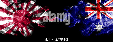 Japan rising sun naval vs Australia, Australian smoky mystic states flags placed side by side. Thick colored silky travel abstract smokes banners Stock Photo