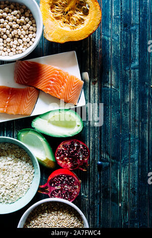Healthy or vegetarian nutrition concept with selection of organic autumn fruits and vegetables, salmon, oats ,chcikpeas, low carbo diet, healthy ketog Stock Photo