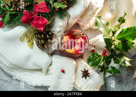 Hot punch, warm sweater and Christmas  decorations Stock Photo