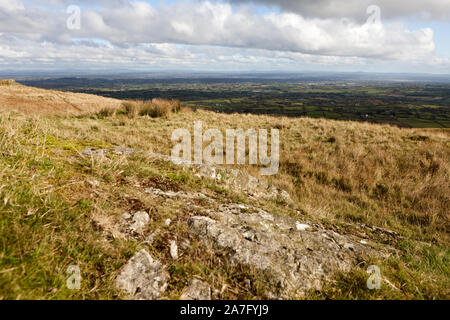 autumn view from Slieve Gallion over County Derry and county antrim Northern Ireland with rock poking through in the foreground Stock Photo