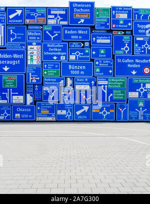Many discarded traffic signs are hanging as decoration outside the Swiss Museum of Transport in Lucerne, Switzerland. Stock Photo