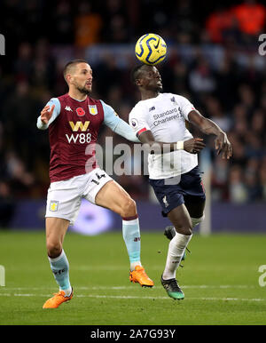 Aston Villa's Conor Hourihane (left) and Liverpool's Sadio Mane battle for the ball during the Premier League match at Villa Park, Birmingham. Stock Photo