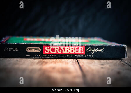 Perth, Scotland - 31 October 2019: Scrabble Board Game | Old Scrabble Box on Vintage Wooden Table Stock Photo