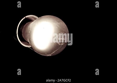 Light Bulb in darkness Stock Photo