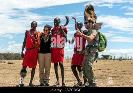MASAI MARA, KENYA - MAY 2014. Unidentified Masai warriors participate in competitions in traditional high jump  with the tourist as part of the cultur Stock Photo