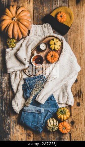 Flat-lay of fall trendy women apparel layout over rustic background Stock Photo