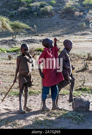 MTO WA MBU, TANZANIA - MAY 2014: Little unidentified Tanzanian children f dressed with simple and dirty clothes in MTO WA MBU Stock Photo