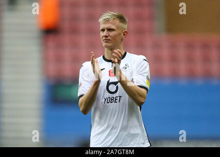 Wigan, UK. 02nd Nov, 2019. Sam Surridge of Swansea City celebrates the win at the end of the game. EFL Skybet championship match, Wigan Athletic v Swansea city at the DW Stadium in Wigan, Lancashire on Saturday 2nd November 2019. this image may only be used for Editorial purposes. Editorial use only, license required for commercial use. No use in betting, games or a single club/league/player publications. pic by Chris Stading/Andrew Orchard sports photography/Alamy Live news Credit: Andrew Orchard sports photography/Alamy Live News Stock Photo