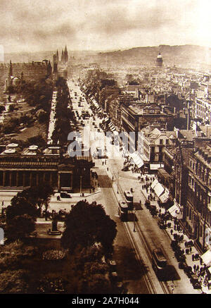 Princes Street Edinburgh, Scotland in 1930 with its shoppers, old  trams and shop window sunshades. The view from the Scott Monument though dated, is remarkably little changed. It is named after the two sons of King George III of England who rejected the original suggestion of  St Giles Street which was the name of a slum area in London. Stock Photo