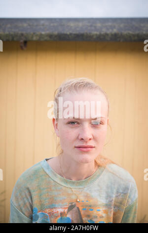 Young blonde woman smirking Stock Photo