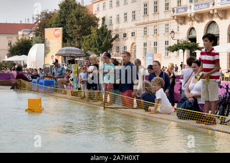 VIENNA, AUSTRIA - August 30, 2019: Viennese art pavilion and Mumok Museum. Parents with children launch boats in the fountain Stock Photo