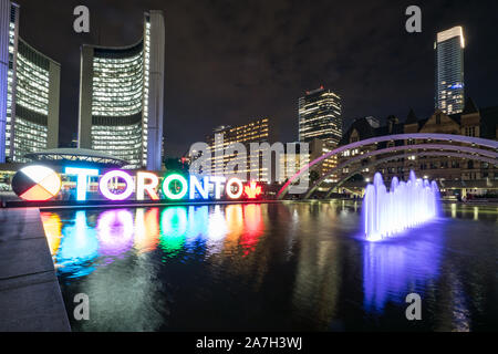 Nathan Phillips Square at night with Toronto Sign and City Hall Building Stock Photo