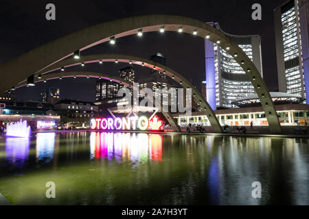 Nathan Phillips Square at night with Toronto Sign and City Hall Building Stock Photo