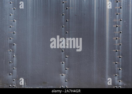 Old Rusty Black Steel Plates and Rivets Background Stock Photo