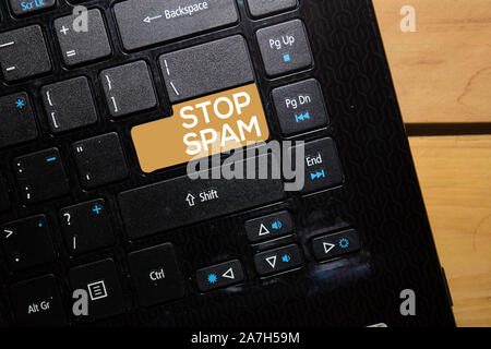 Stop Spam write on keyboard isolated on laptop background Stock Photo