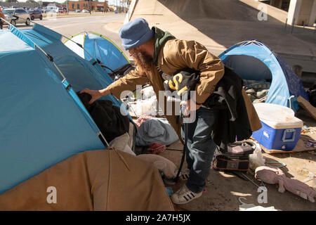 Days before a threatened crackdown by Texas Governor Greg Abbott on public right-of-way camping, homeless Texans await  the governor's and highway department actions in Austin. Most are unsure where they will go as local shelters are over capacity. Stock Photo